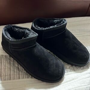 Ugg black ultra mini boots. New never worn. Size 7 or 38. Received as a gift